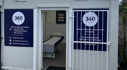 Open entrance of 360 Healthcare Hub in Wigan, England, GB showing interior and informational signs.