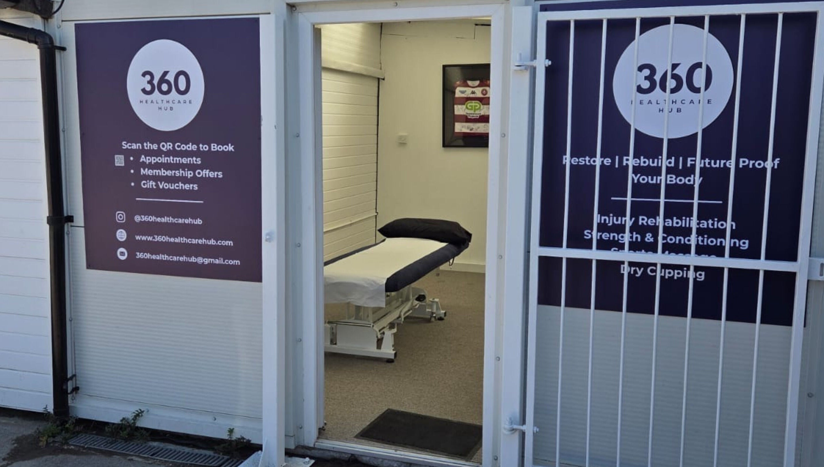 Entrance to 360 Healthcare Hub in Wigan, England, GB. Massage table inside clinic room visible through open door.