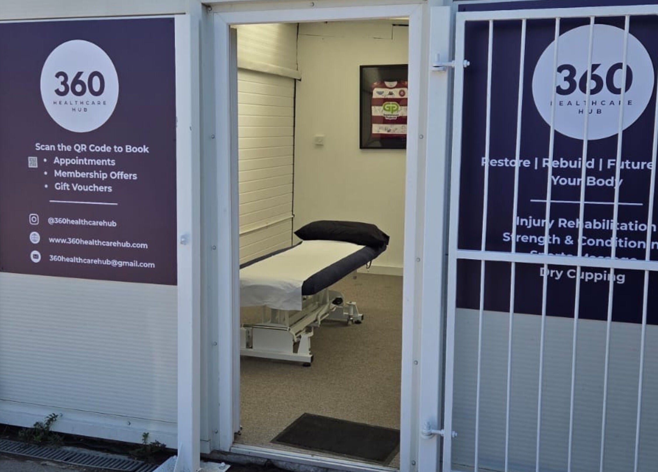 Entrance to 360 Healthcare Hub in Wigan, England, GB. Massage table inside clinic room visible through open door.