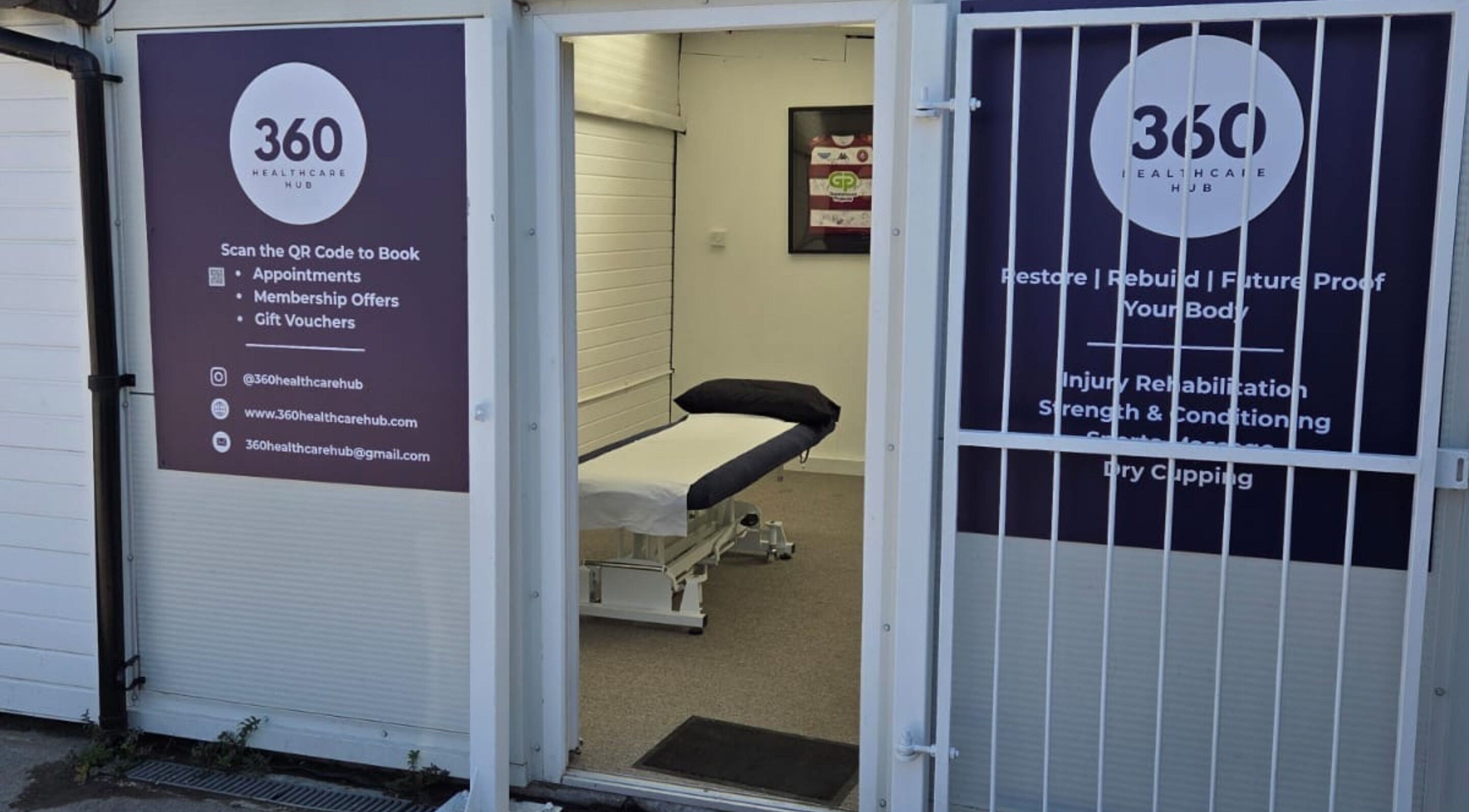 Entrance to 360 Healthcare Hub in Wigan, England, GB. Massage table inside clinic room visible through open door.