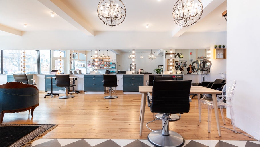 Modern interior of Revolution Hair Studio | St-Henri, Montréal, Québec, CA with stylish chairs and lighting.