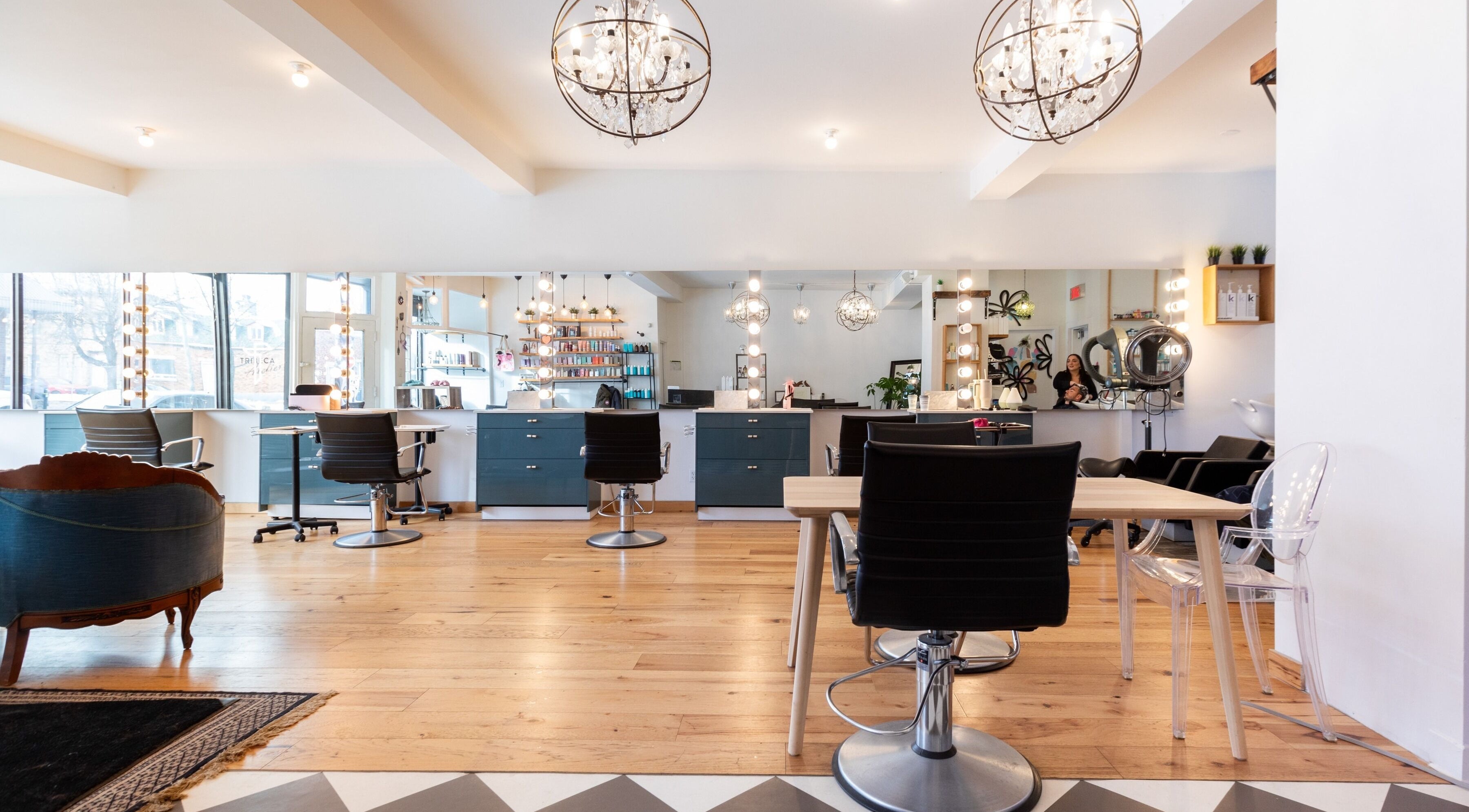 Modern interior of Revolution Hair Studio | St-Henri, Montréal, Québec, CA with stylish chairs and lighting.