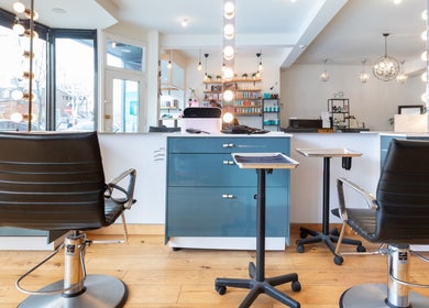 Interior of Revolution Hair Studio | St-Henri, showcasing styling chairs, modern decor in Montréal, Québec, CA.