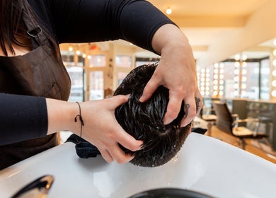 Hair wash at Revolution Hair Studio | St-Henri, Montréal, Québec, CA offering relaxing salon experience.