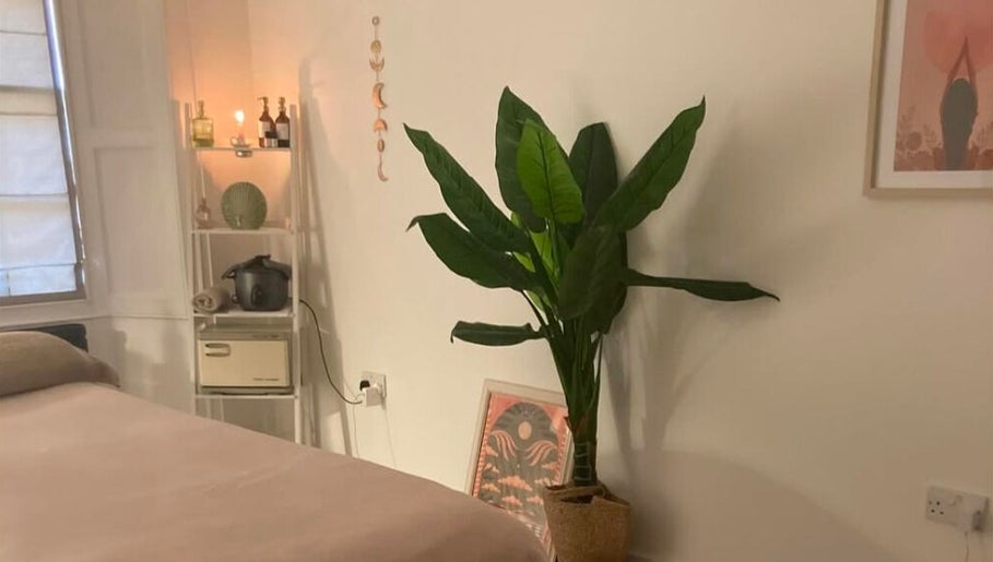 Relaxing room at Rise & Glow Therapies in Cupar, Scotland, GB with cozy decor and calming ambiance.