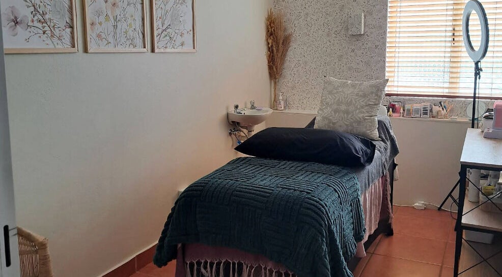 Tranquil treatment room at Honey Bliss Beauty Bar, Durban North, Kwazulu-natal, ZA, featuring cozy decor.