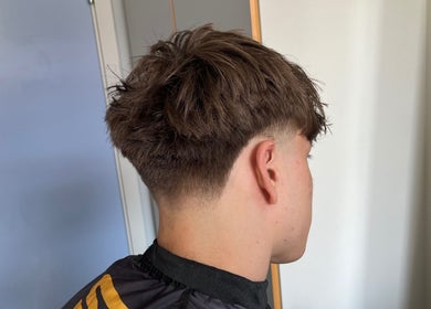 Close-up of a stylish men's taper cut at Boarding Barber, Nyborg, DK.