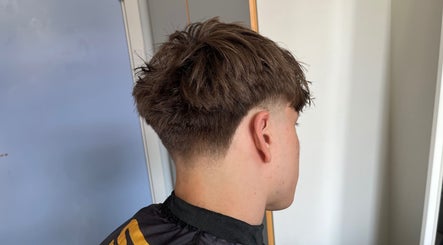 Close-up of a stylish men's taper cut at Boarding Barber, Nyborg, DK.