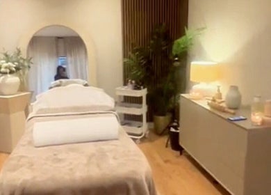 Relaxing spa room with bed at Sculpt Labs - Marple, Stockport, England, GB, featuring elegant decor and lighting.