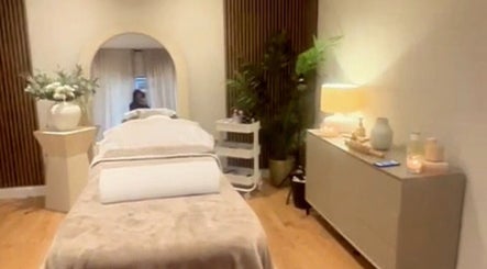 Tranquil spa room at Sculpt Labs - Marple, Stockport, England, GB, featuring a bed, soft lighting, and plants.