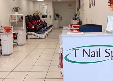 Interior of T Nail Spa, Coral Springs, Florida, US showcasing plush pedicure chairs and modern design.