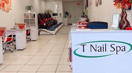 Interior of T Nail Spa, Coral Springs, Florida, US showcasing plush pedicure chairs and modern design.