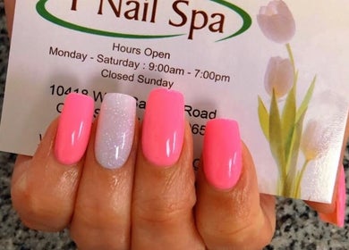 Bright pink and glitter nails at T Nail Spa, Coral Springs, Florida, US showcasing elegant glossy finish.