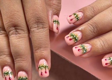 Elegant nail art with festive designs at Glow Up Beauty Lounge by Rei, Fort Meade, Maryland, US.