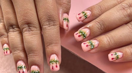 Elegant nail art with festive designs at Glow Up Beauty Lounge by Rei, Fort Meade, Maryland, US.