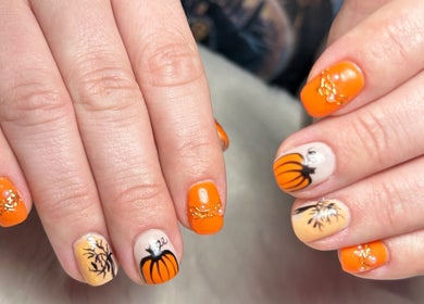Detailed pumpkin nail art at Glow Up Beauty Lounge by Rei, Fort Meade, Maryland, US.