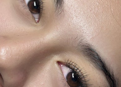 Close-up of radiant eyes showcasing natural beauty enhanced at Glow Up Beauty Lounge by Rei, Fort Meade, Maryland, US.
