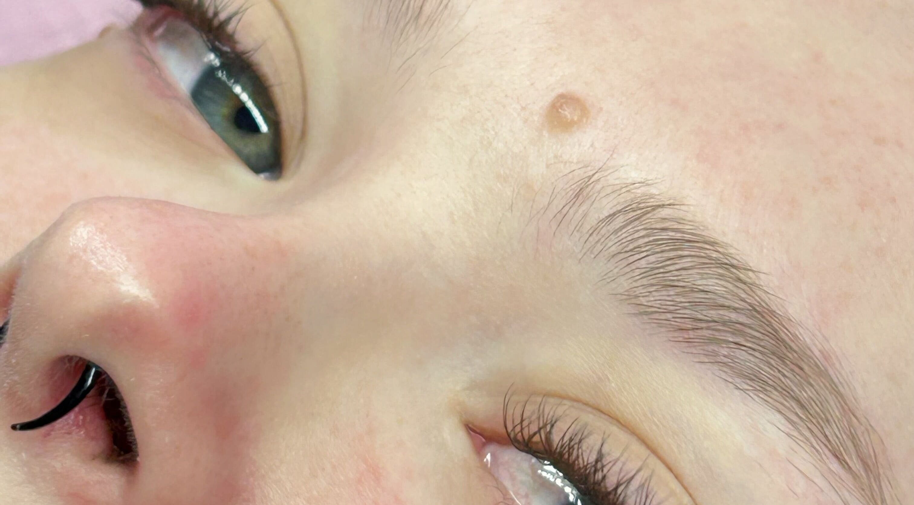 Close-up of perfectly shaped eyebrows at Glow Up Beauty Lounge by Rei, Fort Meade, Maryland, US.