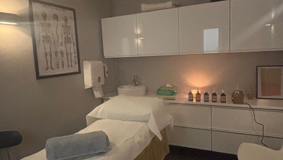 Massage room at The Metropolis Massage, Surbiton, England, GB, featuring a well-prepared treatment table.