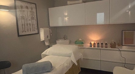Massage room at The Metropolis Massage, Surbiton, England, GB, featuring a well-prepared treatment table.