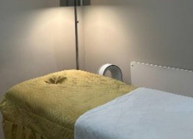 Cozy massage room at The Metropolis Massage in Surbiton, England, GB offers a tranquil relaxation space.
