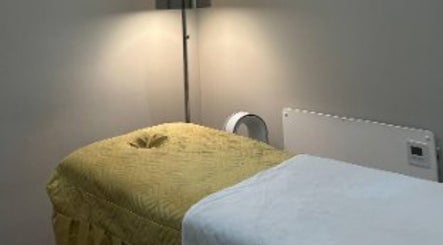 Cozy massage room at The Metropolis Massage in Surbiton, England, GB offers a tranquil relaxation space.