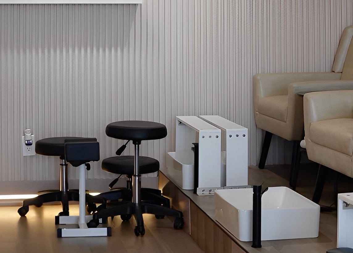 Pedicure area in Zoey Beauty Bar, Mississauga, Ontario, CA, featuring modern seating and equipment.