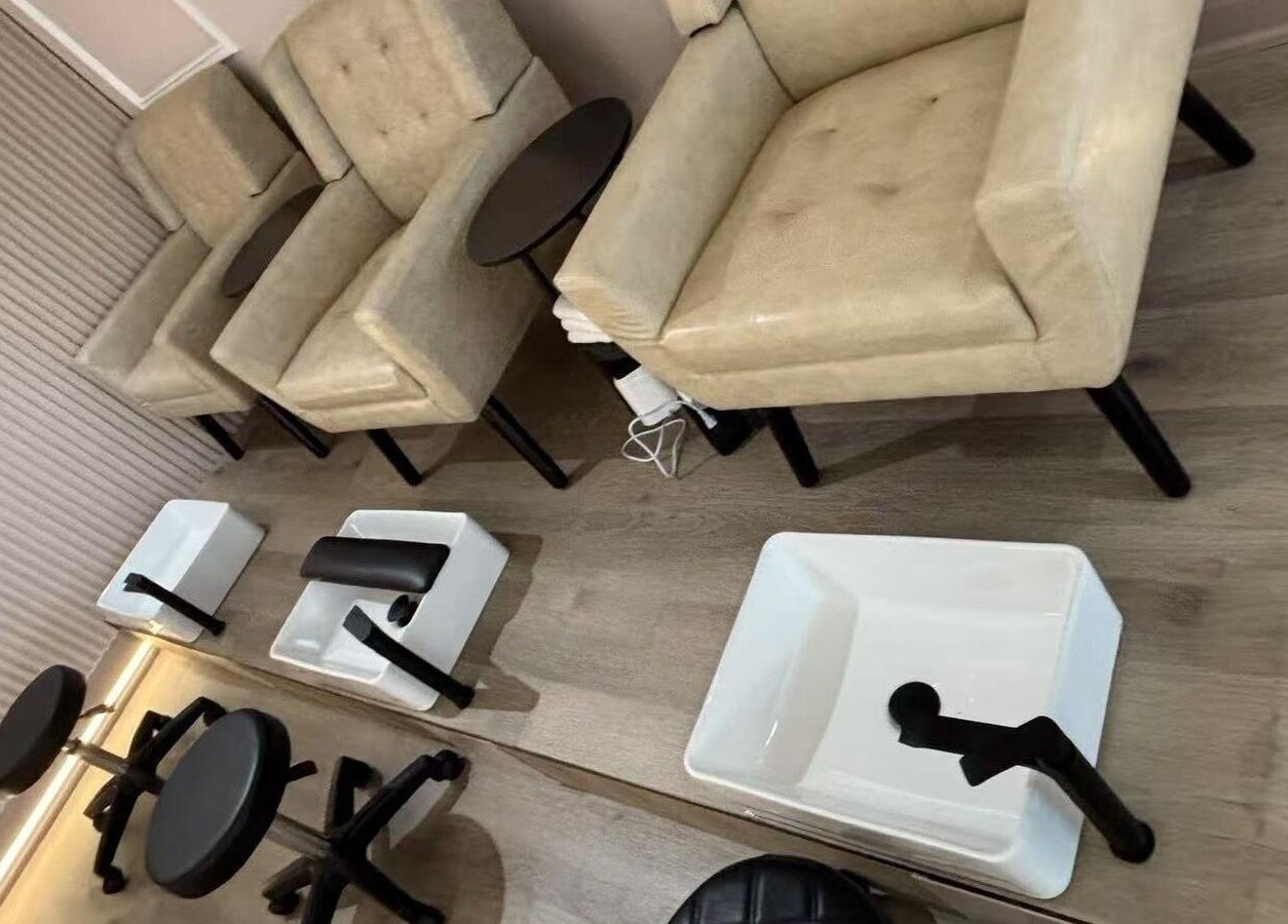 Elegant pedicure area at Zoey Beauty Bar, Mississauga, Ontario, CA with plush chairs and foot basins.