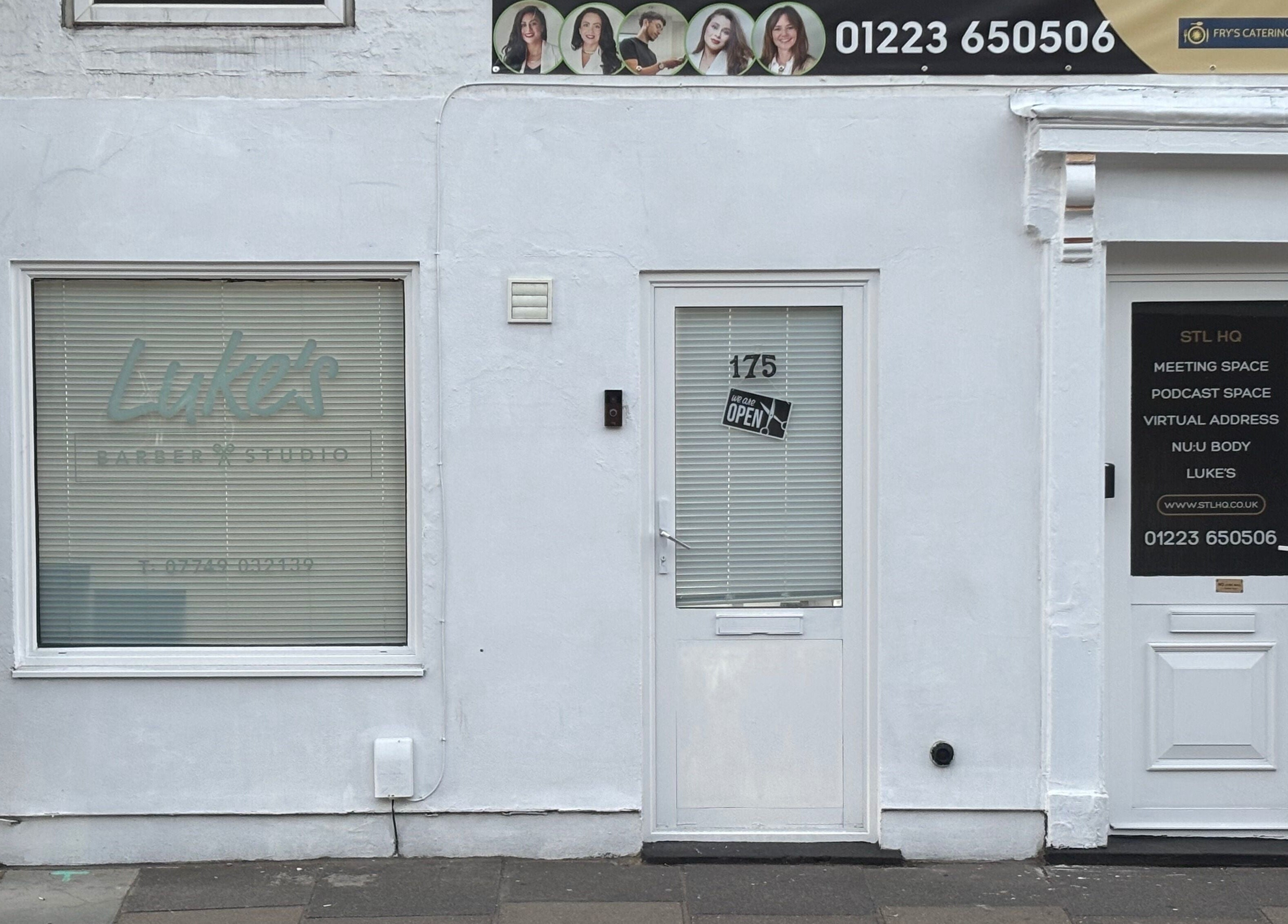 Front entrance of Alfie (Luke’s Studio) in Cambridge, England, GB with signage and contact details.