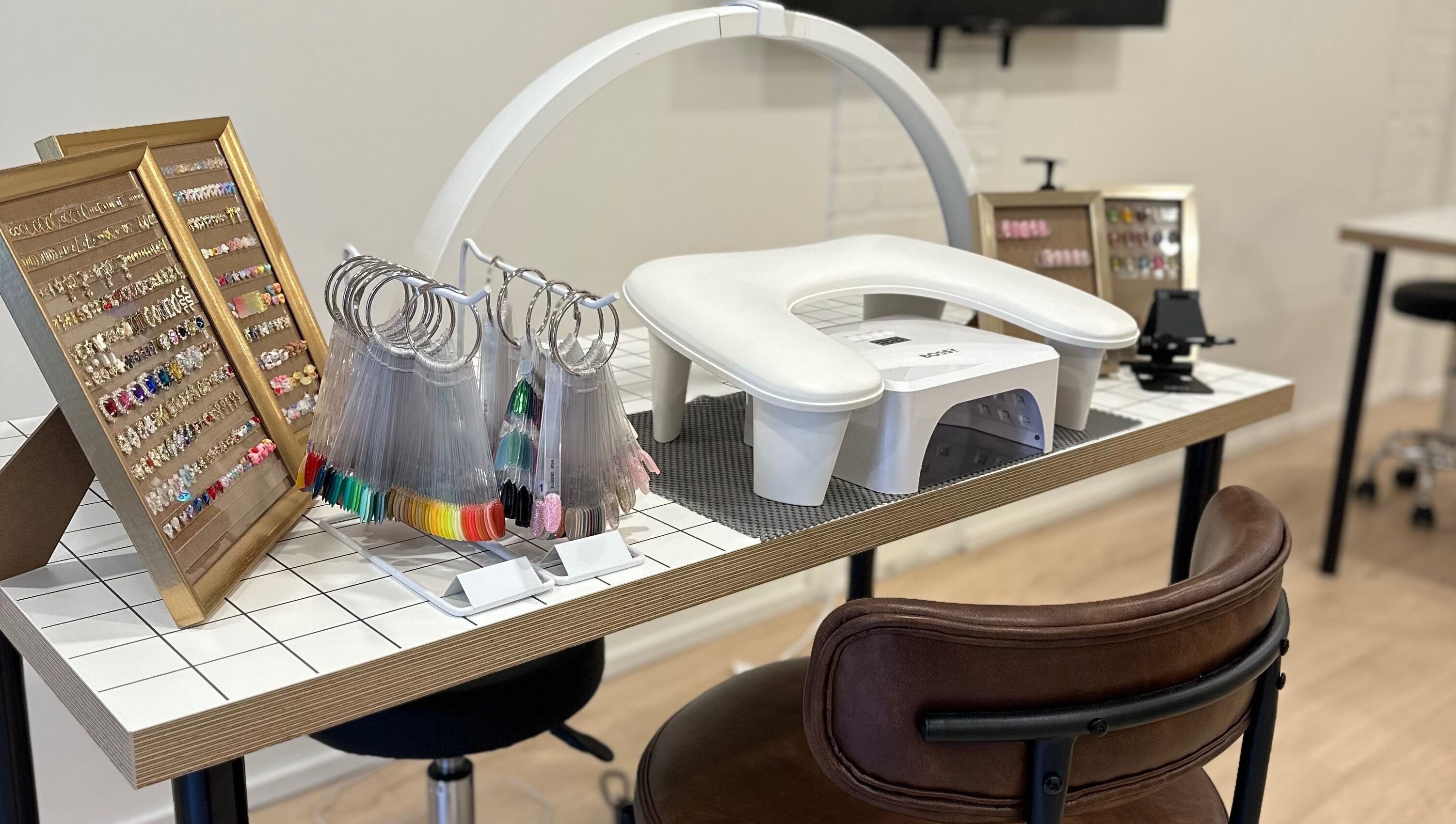 Nail art display and equipment at Studio Enu, Toronto, Ontario, CA. A modern and chic beauty experience.
