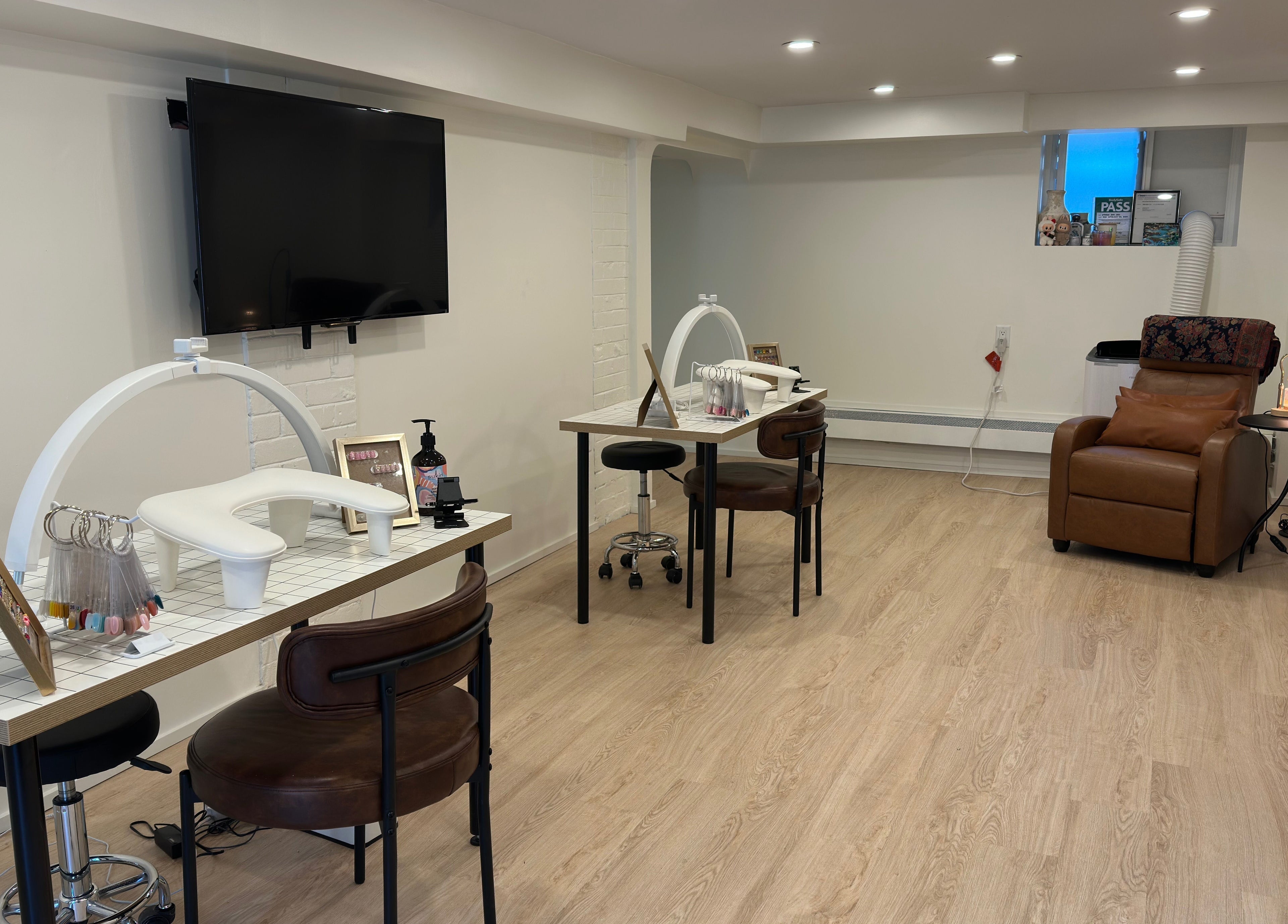Modern nail service area at Studio Enu, featuring stylish seating, Toronto, Ontario, CA.