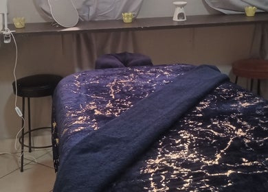 Massage table in tranquil spa room at Is-Care (PTY-LTD), Eshowe, Kwazulu-natal, ZA, offering a relaxing ambiance.