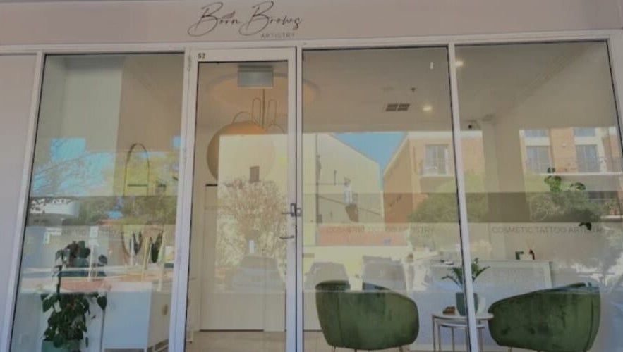 Elegant entrance of WinkBar Perth, Mount Lawley, Western Australia, AU with stylish decor and large glass doors.