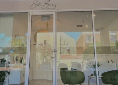 Elegant entrance of WinkBar Perth, Mount Lawley, Western Australia, AU with stylish decor and large glass doors.