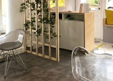Contemporary interior at Citrus Hair Bar, Edinburgh, Scotland, GB, featuring chic transparent chairs and greenery.