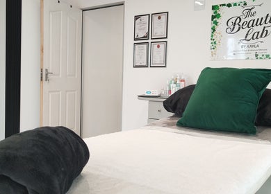Relaxing treatment room at The Beauty Lab by Kayla, Queensburgh, Kwazulu-natal, ZA with plush towels and decor.