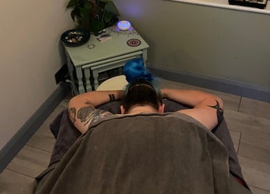 Relaxation at Moon 8 Holistics, a cozy therapy room in Wickham, England, GB providing a serene massage experience.