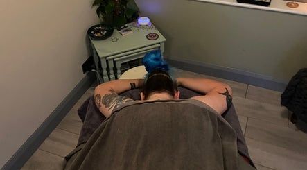 Relaxation at Moon 8 Holistics, a cozy therapy room in Wickham, England, GB providing a serene massage experience.
