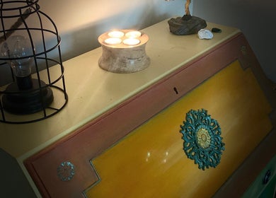 Cozy corner at Moon 8 Holistics, Wickham, England, GB, featuring a rustic lamp and tealight candles.