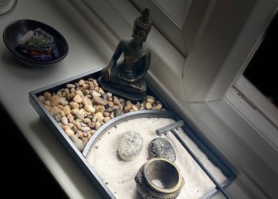 Calming zen garden with sand and pebbles at Moon 8 Holistics, Wickham, England, GB.