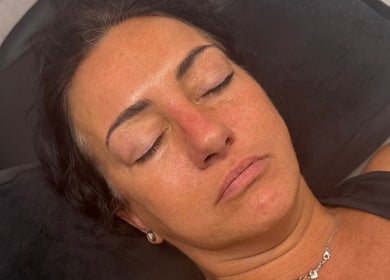 Woman relaxing with closed eyes at Pure Aura Studio in Hindley Green, England, GB.