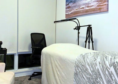 Cozy treatment room at Winked Studio, Toronto, Ontario, CA, featuring a comfortable massage table and serene decor.