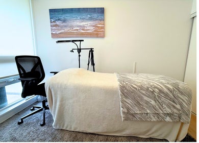Relaxing treatment room at Winked Studio, Toronto, Ontario, CA with a massage table and serene decor.