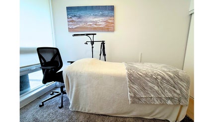 Relaxing treatment room at Winked Studio, Toronto, Ontario, CA with a massage table and serene decor.