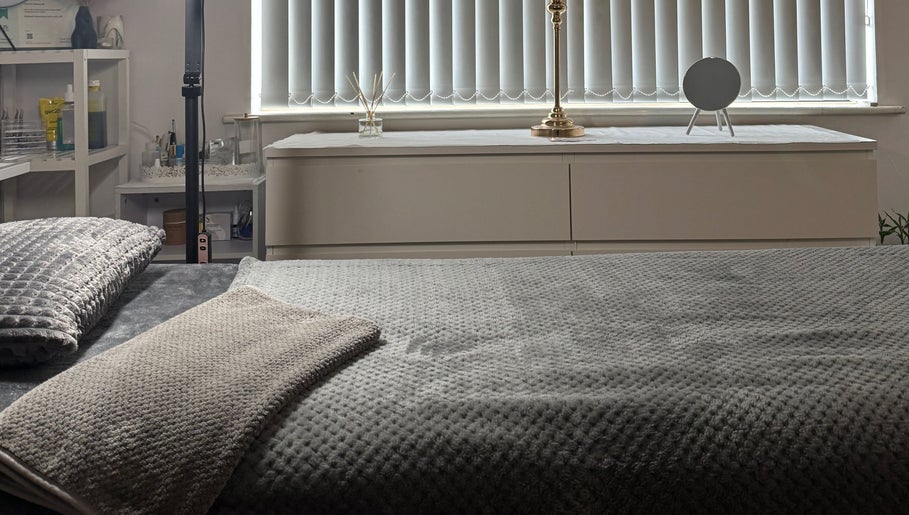 Cozy treatment room at Luminous Skin Clinic, Letterkenny, County Donegal, IE, with plush blankets and soft lighting.