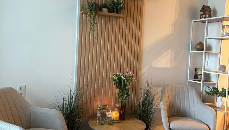 Cozy relaxation nook at Slow Beauty, Tallinn, Harju maakond, EE with chairs, candles, and plants.