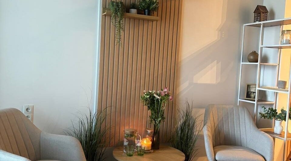 Cozy relaxation nook at Slow Beauty, Tallinn, Harju maakond, EE with chairs, candles, and plants.