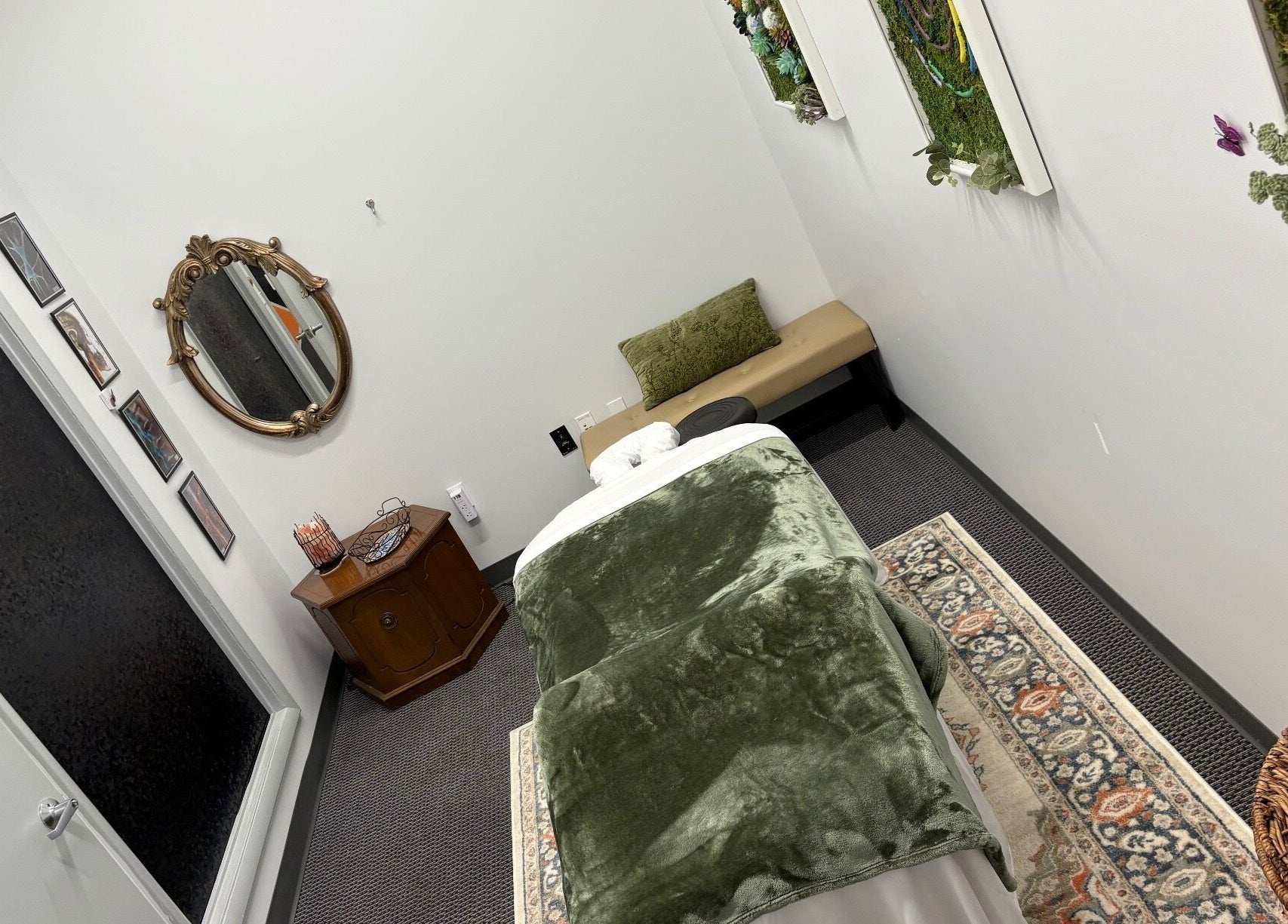 Tranquil massage room at MiTime Massage LLC in Fleming Island, Florida, US, featuring cozy decor and inviting ambiance.