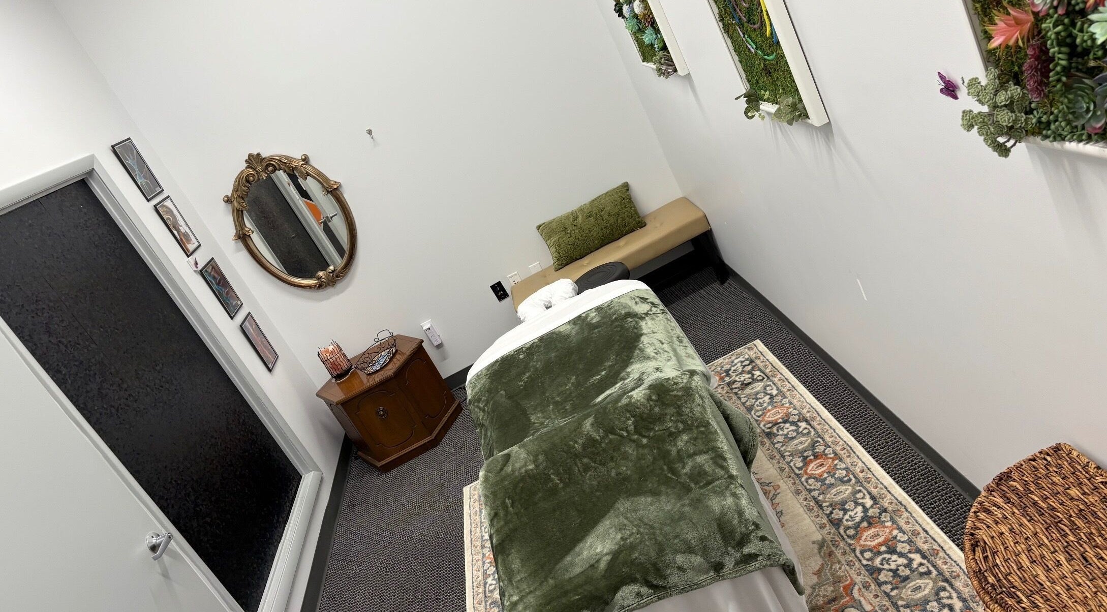 Tranquil massage room at MiTime Massage LLC in Fleming Island, Florida, US, featuring cozy decor and inviting ambiance.