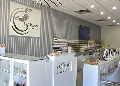 Modern interior of Mc Nails in Gibbons, Alberta, CA, featuring elegant nail salon setup with stylish decor.